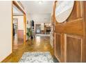 Inviting entryway with stone flooring and view of living room at 304 Winding Stream Trl, Hampton, GA 30228