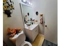 Bathroom with vanity, toilet, and updated fixtures at 2382 Old Rex Morrow Rd, Ellenwood, GA 30294