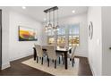 Modern dining room with hardwood floors and a large window at 1036 Culpepper Nw St, Atlanta, GA 30318