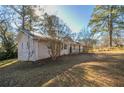 Side view of a ranch house showcasing its landscaping at 2190 Greystone Way, Decatur, GA 30032