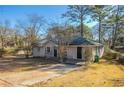 Charming ranch home with mature trees and a paved driveway at 2190 Greystone Way, Decatur, GA 30032