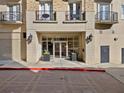 Building entrance at 2255 with elegant planters, glass doors, and brick-paved walkway at 2255 Peachtree Ne Rd # 724, Atlanta, GA 30309