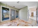 Bright entryway with tiled floor, gray door, and side windows at 4386 Bluebird Ln, Lithia Springs, GA 30122