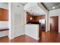 Modern kitchen with dark wood cabinets, stainless steel appliances, and hardwood floors at 3324 Peachtree Ne Rd # 1510, Atlanta, GA 30326