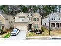 Charming two-story home featuring a brick facade, well-maintained landscaping, and an attached two-car garage at 3227 Hidden Valley Cir, Lawrenceville, GA 30044