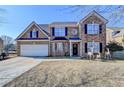 Two-story house with attached garage and landscaping at 861 Chandler Rd, Lawrenceville, GA 30045