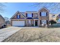 Two-story house with attached garage and landscaping at 861 Chandler Rd, Lawrenceville, GA 30045