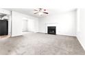 Spacious living room features neutral carpet, fireplace, and ample natural light at 2916 Ward Lake Way, Ellenwood, GA 30294