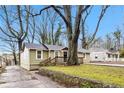 Inviting single-Gathering home with a charming stone retaining wall and mature trees in the front yard at 884 Custer Se Ave, Atlanta, GA 30316