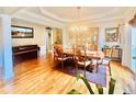 Spacious dining room with hardwood floors, chandelier and built-in hutch at 651 Hexham Ct, Suwanee, GA 30024