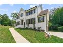 White two-story house with black shutters and a landscaped yard at 2907 Wickford Nw Dr, Kennesaw, GA 30152