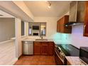Bright kitchen with stainless steel appliances, granite counters, and views to the living room at 4234 Stillwater Dr, Duluth, GA 30096