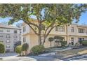 Building exterior showcasing landscaping and a tree at 98 Ardmore Nw Pl # 3, Atlanta, GA 30309