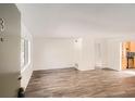 Bright living room with wood-look floors and an open concept at 98 Ardmore Nw Pl # 3, Atlanta, GA 30309