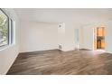 Spacious living room featuring wood-look floors and natural light at 98 Ardmore Nw Pl # 3, Atlanta, GA 30309