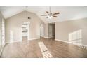 Open living area with hardwood floors and access to kitchen at 6602 Crossing Creek Pt, Austell, GA 30168