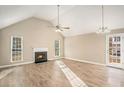 Spacious living room with hardwood floors and a fireplace at 6602 Crossing Creek Pt, Austell, GA 30168