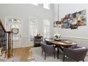 Bright dining room with hardwood floors and a modern chandelier at 10444 Park Walk Pt, Alpharetta, GA 30022