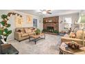 Comfortable living room featuring a brick fireplace and neutral decor at 4288 Post Rd, Winston, GA 30187