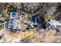 Aerial view of a home showcasing its in-ground pool, mature trees, and private lot at 4116 River Cliff Chase Se, Marietta, GA 30067