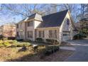 Beautiful brick home featuring a side-entry garage and professionally landscaped front yard, perfect for families at 4116 River Cliff Chase Se, Marietta, GA 30067
