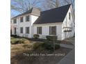 Two story house with a two car garage and gray shutters at 4116 River Cliff Chase Se, Marietta, GA 30067