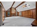 Spacious living room with vaulted ceilings, exposed beams, wood paneling and a brick fireplace at 4116 River Cliff Chase Se, Marietta, GA 30067