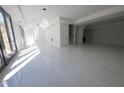 Spacious basement featuring sleek, polished floors and abundant natural light from large sliding glass doors at 4238 Paces Ferry Se Rd, Atlanta, GA 30339