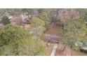 Aerial view of a house nestled among lush trees at 4334 Greenleaf Sw Cir, Atlanta, GA 30331