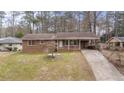 Brick ranch house with a driveway and landscaped yard at 4334 Greenleaf Sw Cir, Atlanta, GA 30331