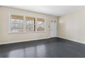 Living room with dark hardwood floors and large windows at 4334 Greenleaf Sw Cir, Atlanta, GA 30331