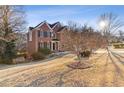 Brick home with a large backyard and mature trees at 1172 Lake Washington Dr, Lawrenceville, GA 30043