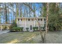 Two-story house with a covered carport and landscaping at 3144 Granada, Atlanta, GA 30344
