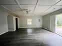 Spacious bedroom with wood-look floors and ceiling fan at 5117 Panola Valley Dr, Lithonia, GA 30038
