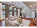 Bright living room with vaulted ceiling, multiple windows, and hardwood floors at 6360 Ashdale Dr, Atlanta, GA 30349