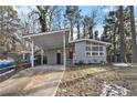 Ranch house with carport, gray brick exterior and landscaping at 2280 Connally Ct, Atlanta, GA 30344