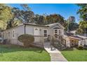 Updated ranch home features a gray exterior and a spacious deck at 16 S Eugenia Nw Pl, Atlanta, GA 30318