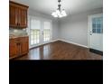 Bright dining area with hardwood floors and French doors at 1792 Hammond Woods Sw Cir, Marietta, GA 30008