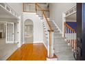 Two-story entryway with hardwood floors and staircase at 5615 Forkwood Nw Dr, Acworth, GA 30101