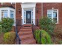 Brick steps leading to a black front door at 5615 Forkwood Nw Dr, Acworth, GA 30101