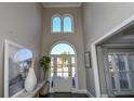 Bright and airy two-story foyer with hardwood floors and high ceilings at 605 Rose Creek Cir, Duluth, GA 30097