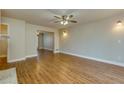 Spacious living room with hardwood floors and ceiling fan at 242 Chads Ford Way, Roswell, GA 30076