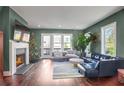 Spacious living room featuring a fireplace and large windows at 308 Gibson Se St, Atlanta, GA 30316