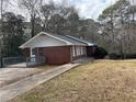 Brick ranch home with a deck and landscaped yard at 4515 Wonder Valley Trl, Decatur, GA 30034