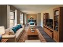 Spacious living room featuring hardwood floors, comfortable furniture, and built-in shelving at 4515 Wonder Valley Trl, Decatur, GA 30034