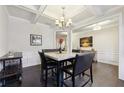 Spacious dining room with hardwood floors and coffered ceiling at 1240 Roswell Manor Cir, Roswell, GA 30076