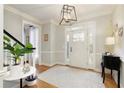 Bright entryway with hardwood floors and white door at 6320 Bannerhorn Run, Alpharetta, GA 30005