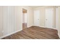 Bright hallway with wood-look floors and access to bedrooms at 2159 Macon Sw Dr, Atlanta, GA 30315