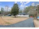 Spacious home with long driveway and wooded backyard at 1955 E Lake Dr, Marietta, GA 30066