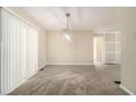 Bright dining room with neutral carpeting and chandelier at 3766 Stanford Cir, Decatur, GA 30034